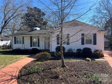 Charming one story house with a well-maintained front yard and inviting red brick walkway at 3240 Sunset Dr, Charlotte, NC 28209