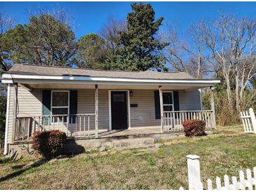 Charming single-story home with a welcoming front porch and a well-maintained yard at 44 Fenix Sw Dr, Concord, NC 28025