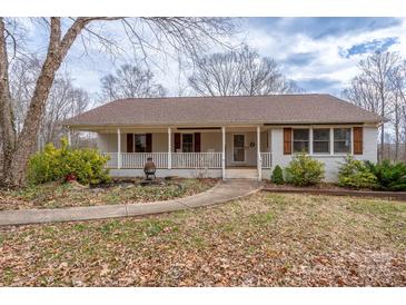 Charming single-story home featuring a welcoming front porch and professionally landscaped front yard at 5368 Limestone Dr, Catawba, NC 28609