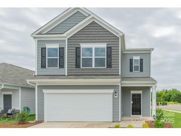Charming two-story home with a gray exterior, black shutters, white trim, and a two-car garage at 1101 Red River Dr, Salisbury, NC 28144
