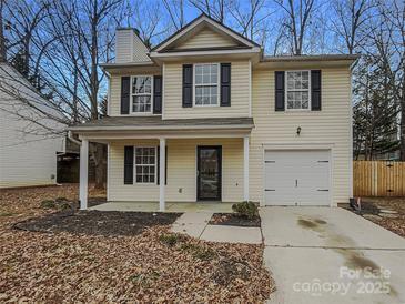 Charming two-story home with a well-maintained lawn and attached garage at 1411 Swaying Branch Ln, Clover, SC 29710