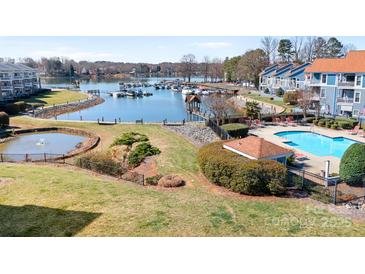 Scenic aerial view showcasing the community's pool, marina, and waterfront location on Lake Norman at 1107 Torrence Cir, Davidson, NC 28036