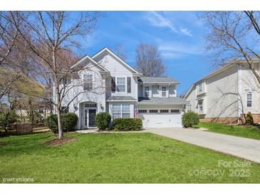 Attractive two-story home with a well-kept lawn, a two-car garage, and a welcoming front entrance at 6816 Charter Hills Rd, Charlotte, NC 28277
