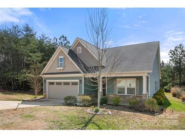 Charming single-Gathering home with a two-car garage, stone accents, and lovely curb appeal at 10159 Lakeshore Dr, Lancaster, SC 29720