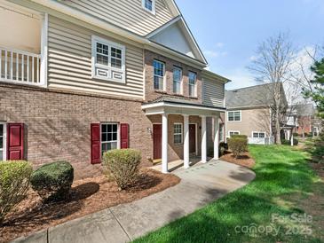 Charming brick townhouse with inviting front entrance and well-maintained landscaping at 12008 Bordeaux St, Charlotte, NC 28277