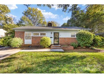Charming one-story home with brick accents and mature landscaping at 4635 General Pershing Dr, Charlotte, NC 28209