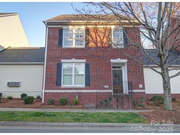 Charming brick two-story home with black shutters and landscaped front yard at 508 Summerfield Pl, Belmont, NC 28012