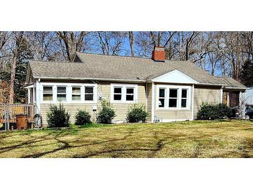 Charming single-story home with a well-maintained lawn, brick chimney, and freshly painted exterior at 1377 S Aspen St, Lincolnton, NC 28092