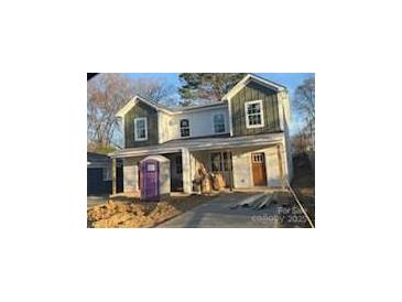 New construction two-story home with mixed siding and a front yard under construction at 1518 Norris Ave, Charlotte, NC 28206