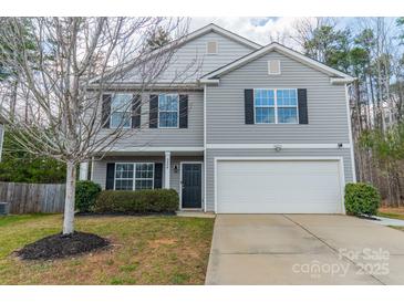 Two-story home featuring gray siding, black shutters, and a two-car garage at 5306 Graypark Dr, Charlotte, NC 28269