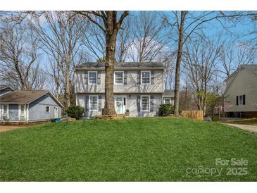 Charming two-story home with manicured lawn and inviting curb appeal at 9613 Central Dr, Mint Hill, NC 28227