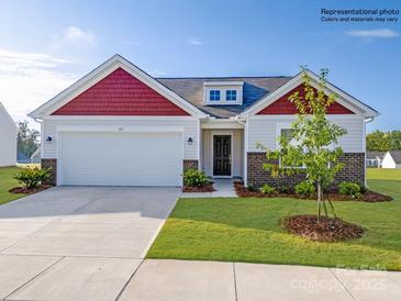 Charming one-story home featuring a two-car garage, well-maintained lawn, and inviting front entrance at 1197 Blackburn Cir, Edgemoor, SC 29712