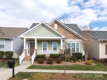 Charming single-Gathering home with a welcoming front porch and well-maintained landscaping at 12432 Bradford Park Dr, Davidson, NC 28036