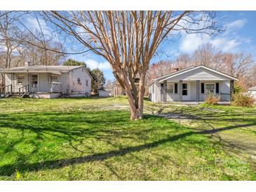 Charming front yard view of home with mature tree, and well-maintained lawn and classic architectural details at 133 Sutton S Rd, Fort Mill, SC 29708