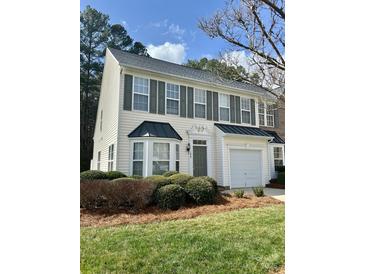 Charming two-story home with a well-manicured lawn and a one car garage at 1629 Backcreek Ln, Gastonia, NC 28054