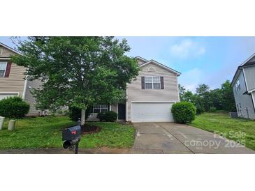 Charming two-story home with a well-maintained front yard and attached garage at 2108 Cranberry Woods Ct, Charlotte, NC 28208