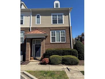 Charming brick-and-siding townhouse with a covered entrance and well-maintained landscaping at 8410 Scotney Bluff Ave, Charlotte, NC 28273