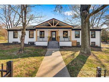 Inviting home with a large front porch and a combination of modern and traditional design elements at 1206 9Th Nw St, Hickory, NC 28601