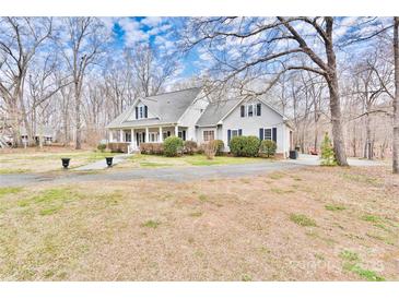 Charming two-story home with a welcoming front porch and well-maintained landscaping at 2025 Sojourn Rd, Marshville, NC 28103