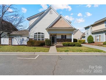 Charming two-story home featuring manicured landscaping and classic architectural details at 3320 Tulip Tree Ln, Charlotte, NC 28273