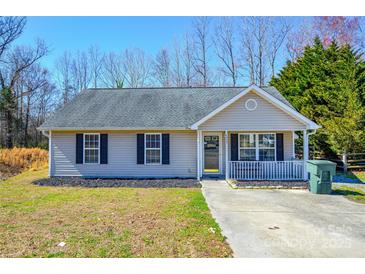 Charming single-story home features a welcoming front porch, black shutters, and well-maintained landscaping at 3345 Hunting Wood Ct, Gastonia, NC 28052