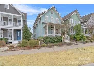 Charming two-story home boasts a welcoming front porch and well-maintained landscaping at 664 Bluff Loop Rd # 202, Rock Hill, SC 29730