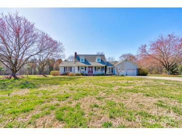 Inviting home with a well-manicured lawn and a charming front porch, perfect for relaxing and enjoying the outdoors at 723 W Zion Church Rd, Shelby, NC 28150