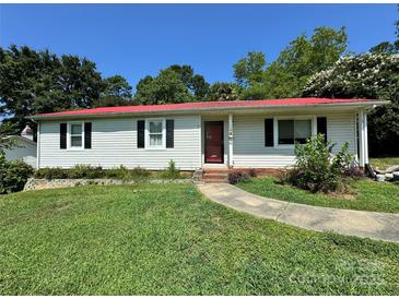 Charming one-story home features a red roof, light siding, and a well-manicured lawn at 2027 Downey St, Rock Hill, SC 29732