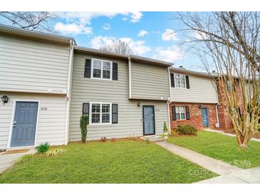 Charming townhome with gray siding, black shutters, and a well-manicured front lawn at 3224 Heathstead Pl, Charlotte, NC 28210