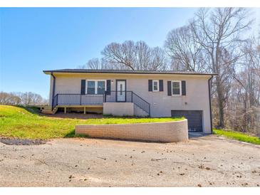 Charming brick home with a well-maintained front yard and an attached garage at 108 Spiral Ln, Shelby, NC 28152