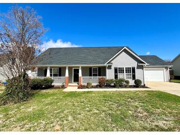 Charming single-story home features a front porch and well-maintained lawn and landscaping at 4232 Cornelia Ln, Rock Hill, SC 29732