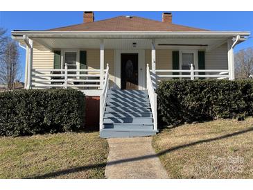 Charming single-Gathering home showcasing a cozy front porch and well-maintained landscaping at 516 W 7Th St, Kannapolis, NC 28081