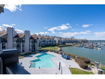 A stunning view of the complex pool, boat docks, and lake make this a great location for recreation at 18877 Vineyard Point Ln, Cornelius, NC 28031