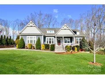 Charming single-Gathering home with well-maintained landscaping, covered porch, and inviting curb appeal at 6016 Dogwood Blvd, Kannapolis, NC 28081