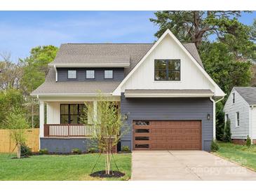 Charming two-story home with a modern farmhouse design and well-maintained landscaping at 1210 Skyview Rd, Charlotte, NC 28208