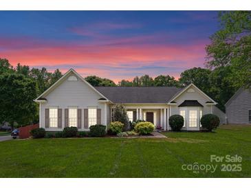 Charming single-story home with manicured lawn and landscaping in a tranquil setting at 196 Gabriel Dr, Mooresville, NC 28115