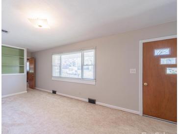 Bright living room featuring neutral walls and a large window for plenty of light at 2310 Clay St, Kannapolis, NC 28083