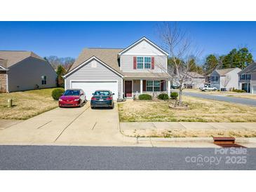 Charming two-story home with a well-manicured lawn and inviting front porch at 137 Mossy Pond Rd, Statesville, NC 28677