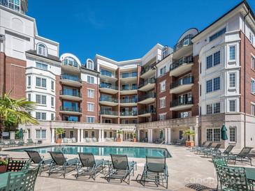 Resort-style apartments overlooking a pool and lounge area, offering luxury and leisure at 300 W 5Th W St # 407, Charlotte, NC 28202