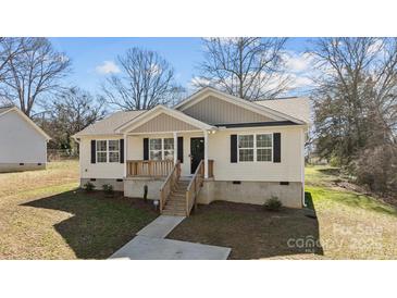 Charming single-story home with welcoming porch, well-manicured lawn, and tasteful landscaping at 1707 W 4Th Ave, Gastonia, NC 28052