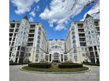 Elegant condominium with manicured grounds, featuring manicured hedges and striking architecture at 2823 Providence Rd # 236, Charlotte, NC 28211