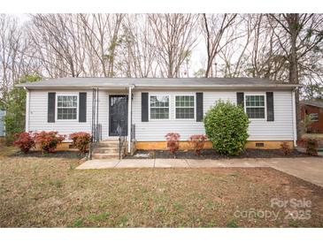 Charming single-story home with a well-maintained lawn and mature landscaping at 4910 Lailwood Cir, Charlotte, NC 28227