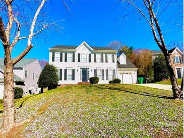 Charming two-story home featuring black shutters, a well-manicured lawn, and an attached two-car garage at 9146 Austin Ridge Ln, Charlotte, NC 28214