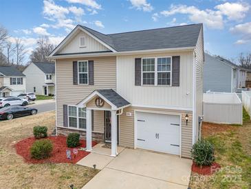 Charming two-story home with a well-maintained yard and attached garage in a desirable neighborhood at 1301 Waylon Ave, Gastonia, NC 28054