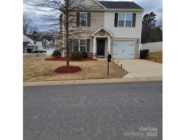 Charming two-story home featuring a well-manicured front yard and inviting entrance at 1301 Waylon Ave, Gastonia, NC 28054