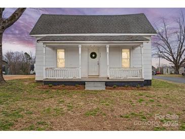 Charming home featuring a quaint front porch with classic architectural details at 517 S Central Ave, Landis, NC 28088