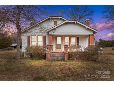 Charming single Gathering home featuring brick columns and front porch at 825 Rock Grove Church Rd, Salisbury, NC 28146