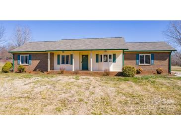 Charming single-story home with brick accents, shutters and inviting front porch at 19 Harolds Ct, Taylorsville, NC 28681