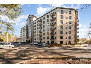 A modern condominium with large windows and small balconies on a sunny day with ample parking at 211 Heritage Blvd # 612, Fort Mill, SC 29715