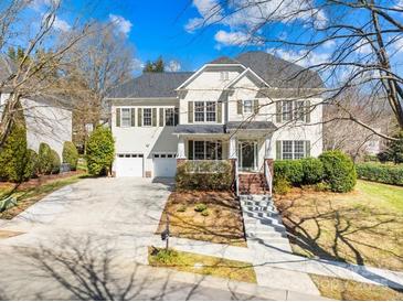 Charming two-story home featuring a two-car garage, landscaped front yard, and inviting front porch at 9433 Gilpatrick Ln, Huntersville, NC 28078